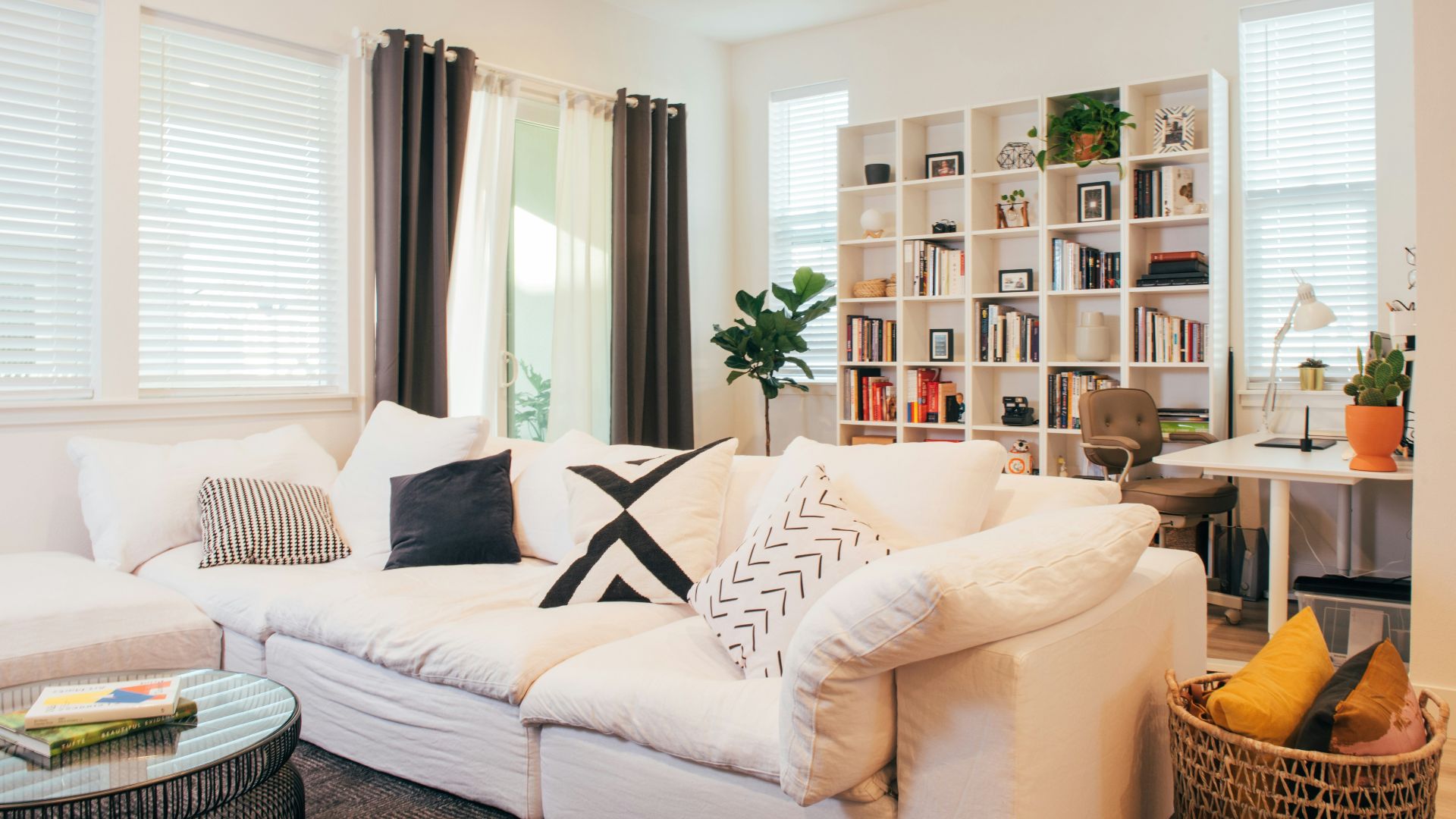 A living room filled with furniture and a large window