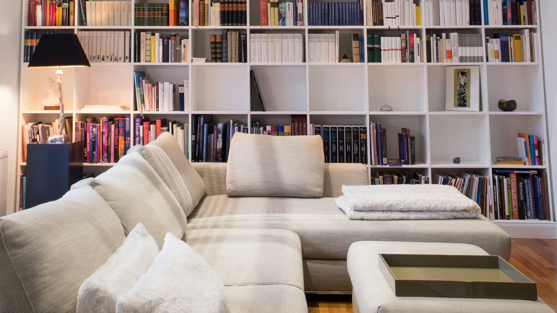 white wooden book shelves with books