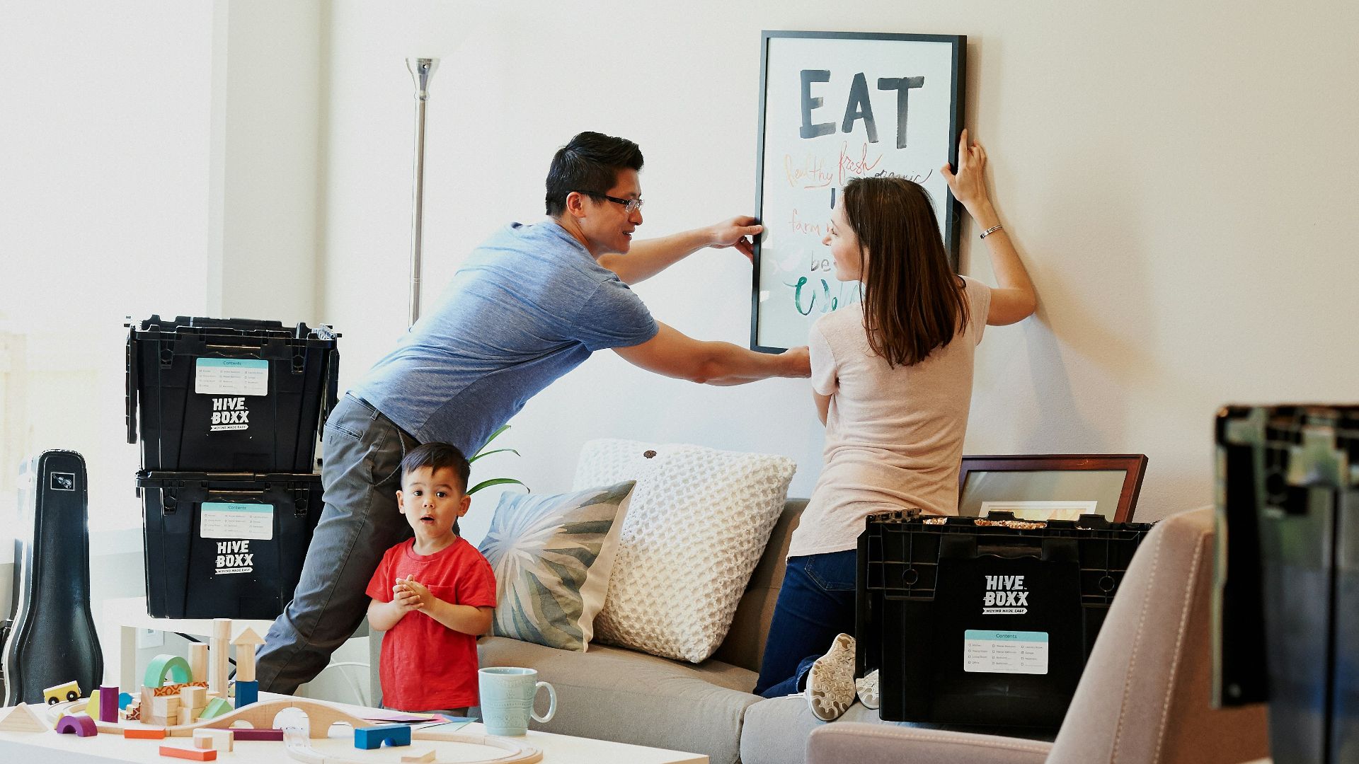 woman in blue denim jacket standing beside woman in black shirt