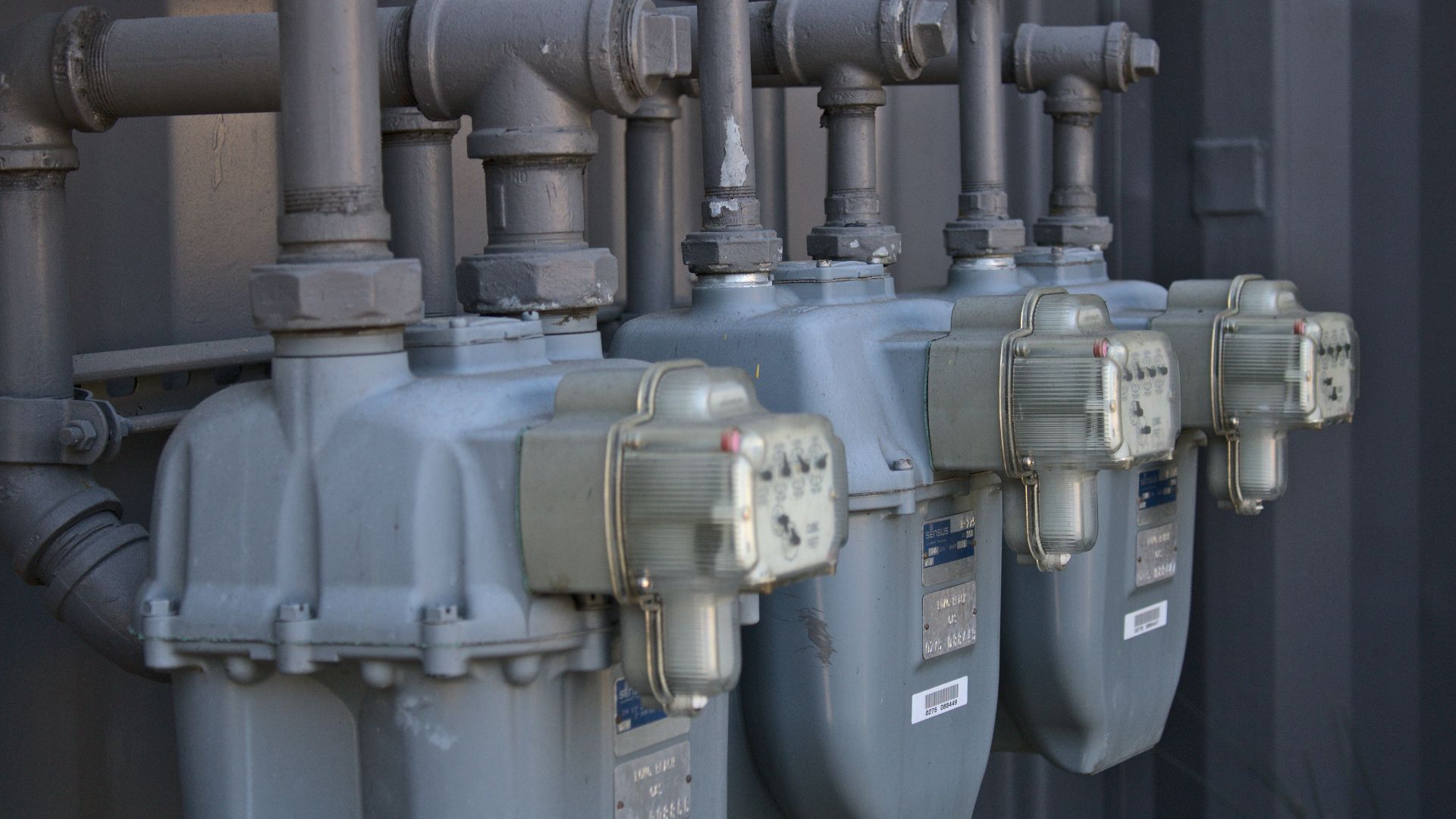 a row of water pumps sitting next to each other