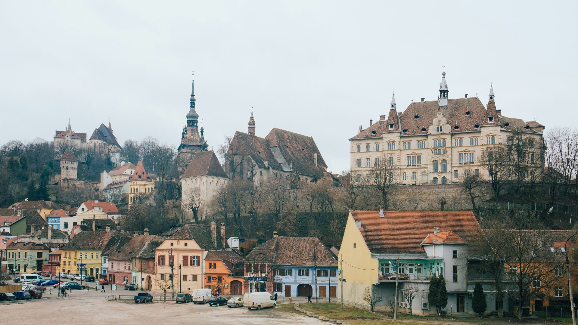 beige and brown gothic building on hill