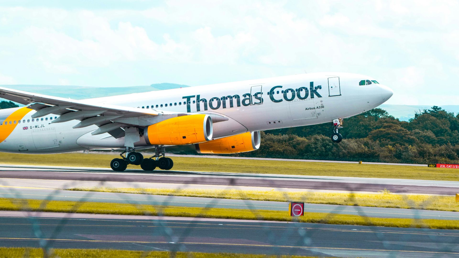 a large jetliner taking off from an airport runway