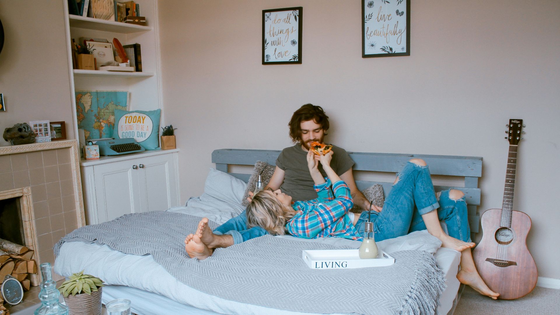 man and woman lying on bed