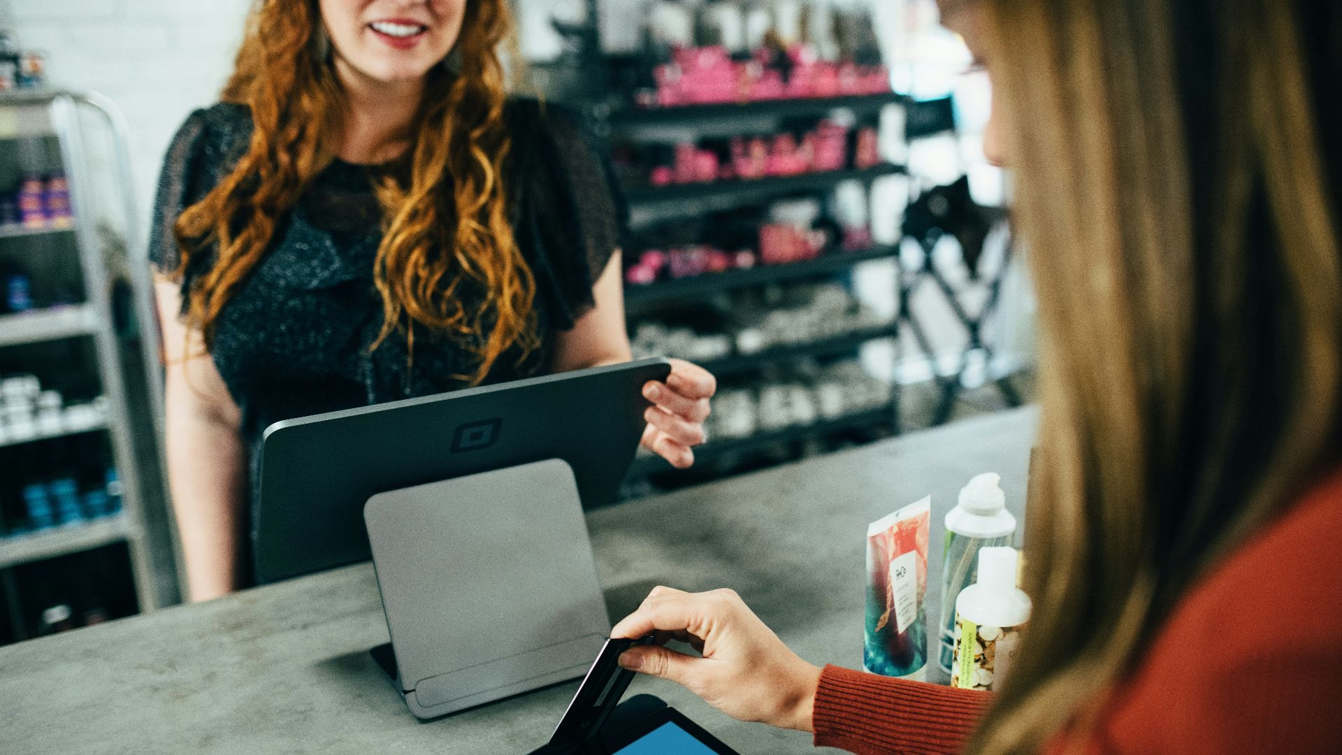 woman holding magnetic card