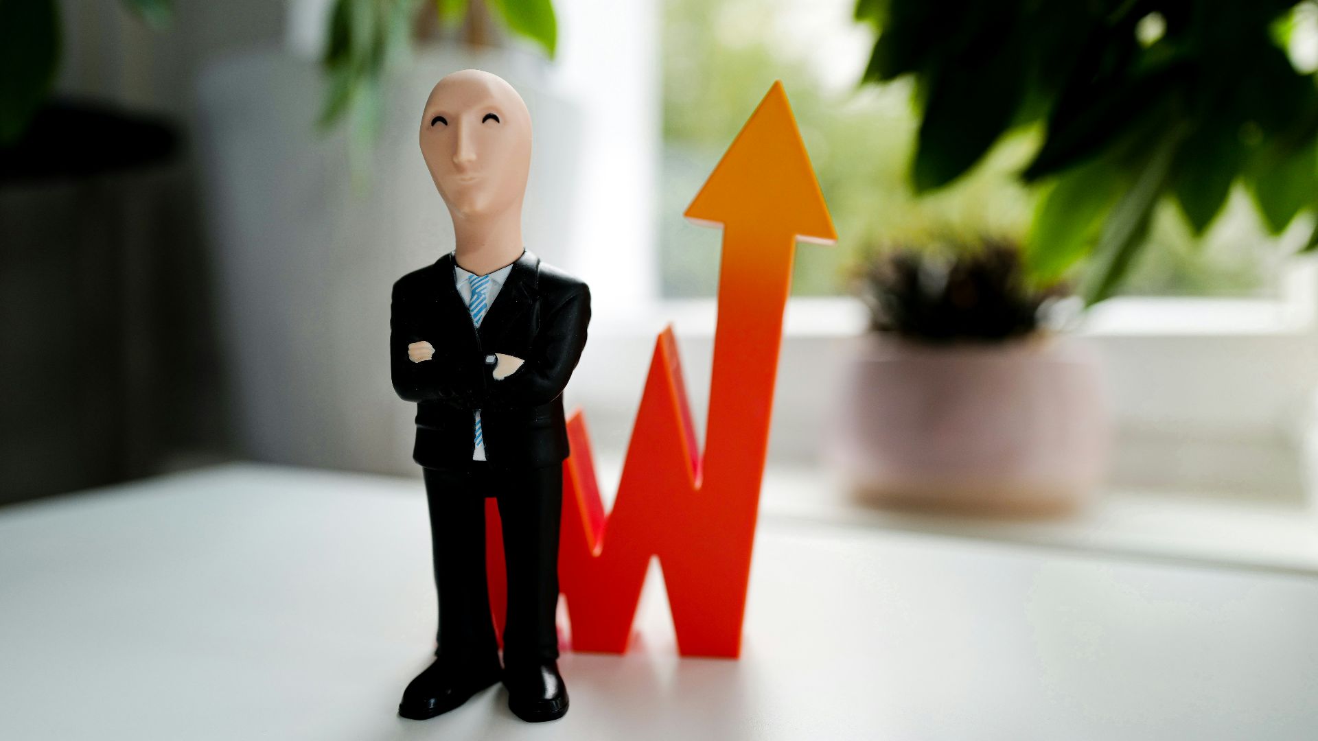 man in black suit jacket and black pants figurine