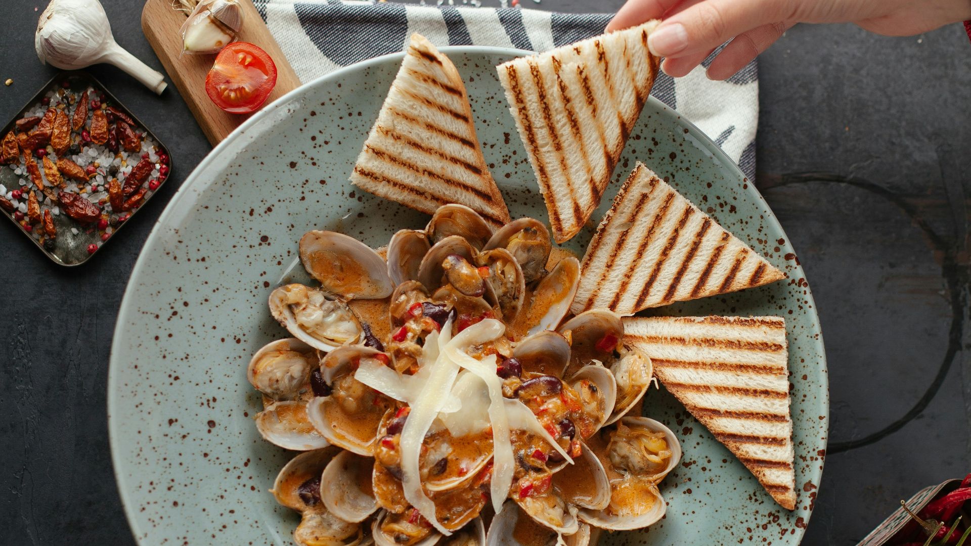 brown and white sliced food on white ceramic plate
