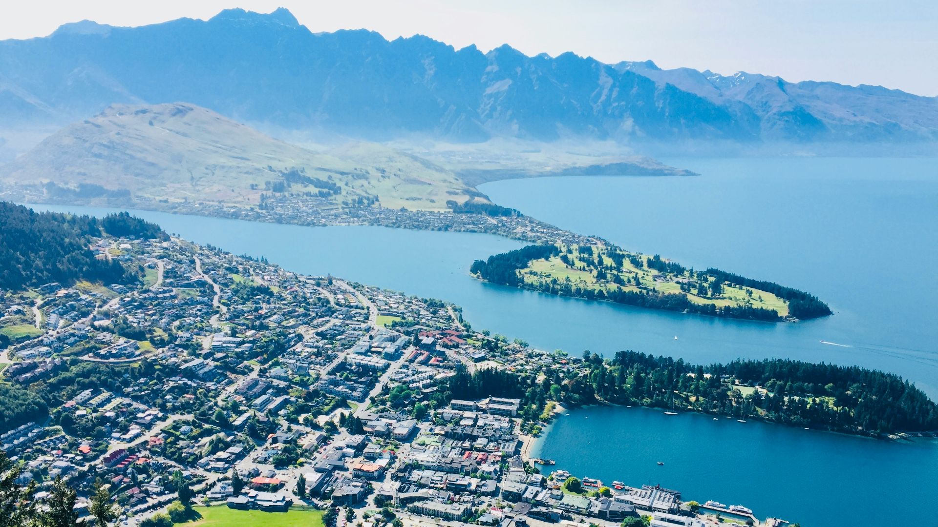 aerial view of city near body of water during daytime