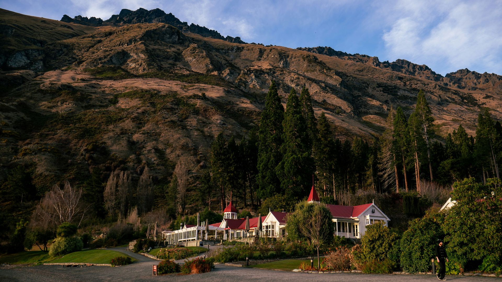 A large mountain with houses on the side of it