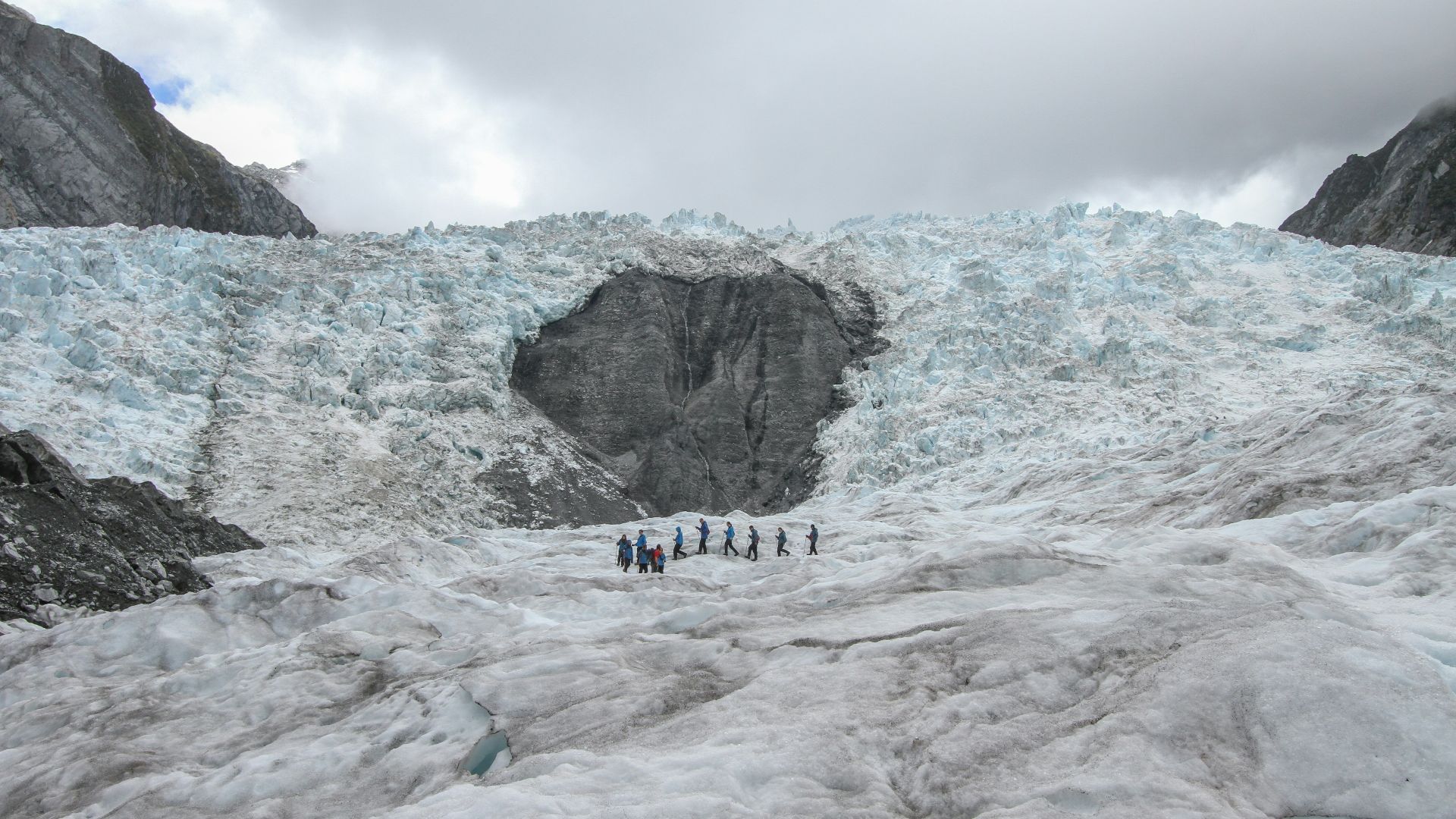 people standing on Glacier Bay, Iceland