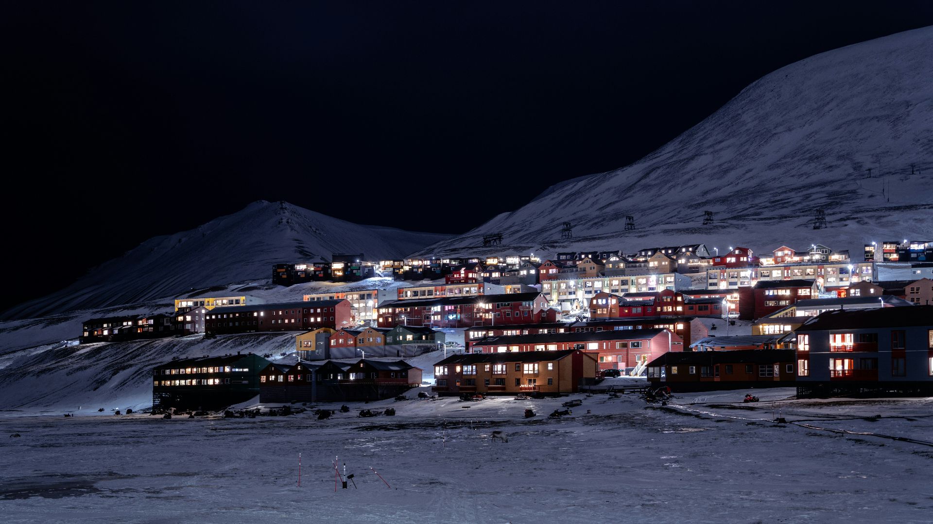 a night view of a town in the mountains