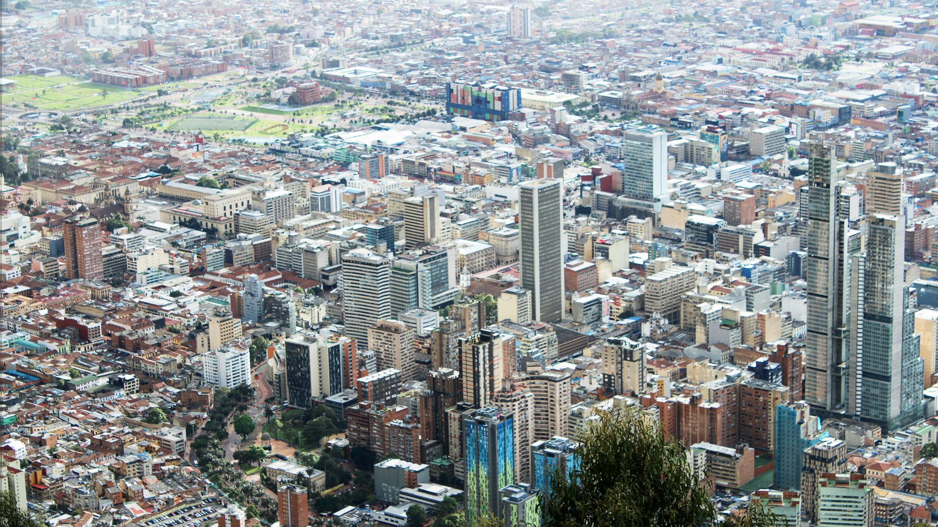 A view of a city from the top of a hill