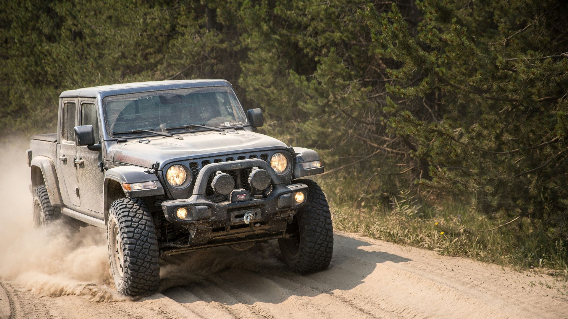 black and white jeep wrangler on dirt road during daytime
