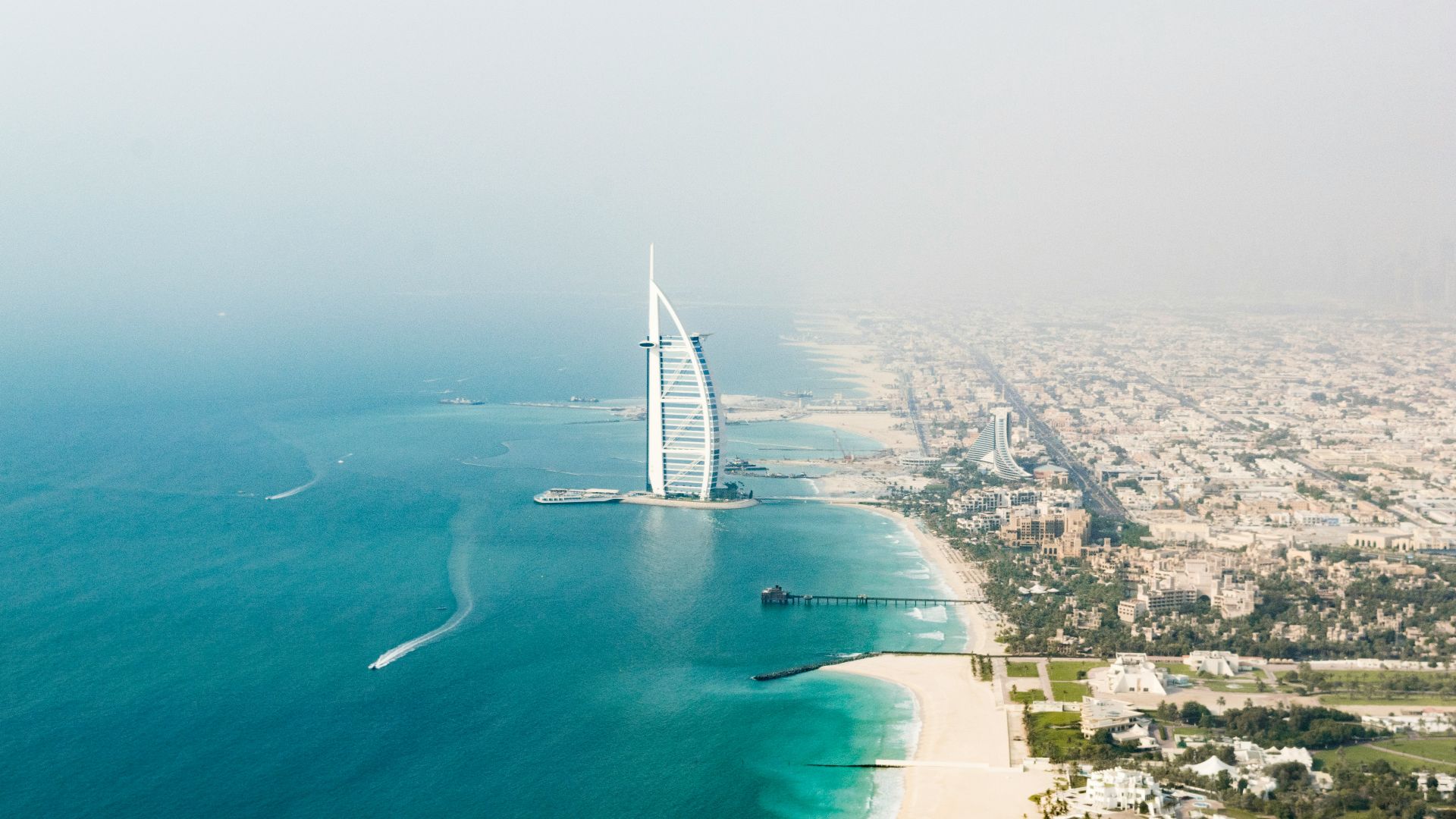 white and blue boat on sea during daytime
