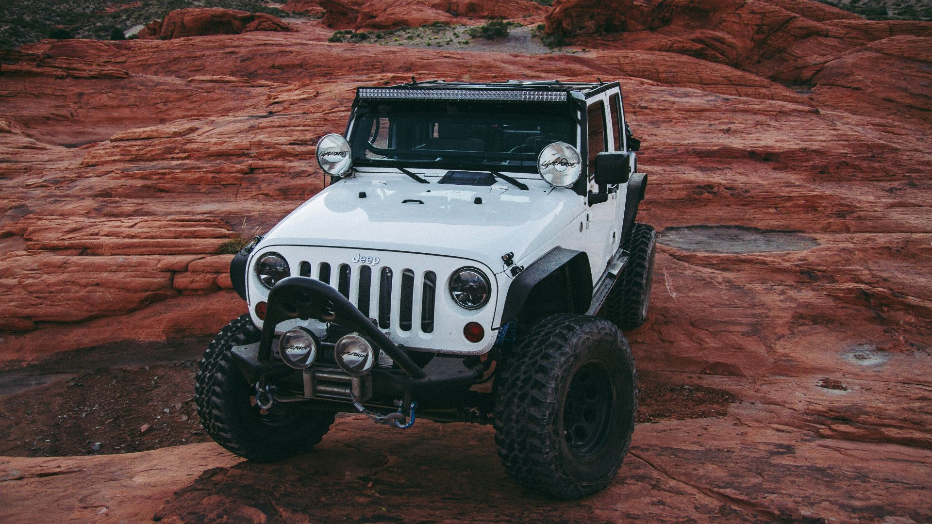 white Jeep Wrangler on land