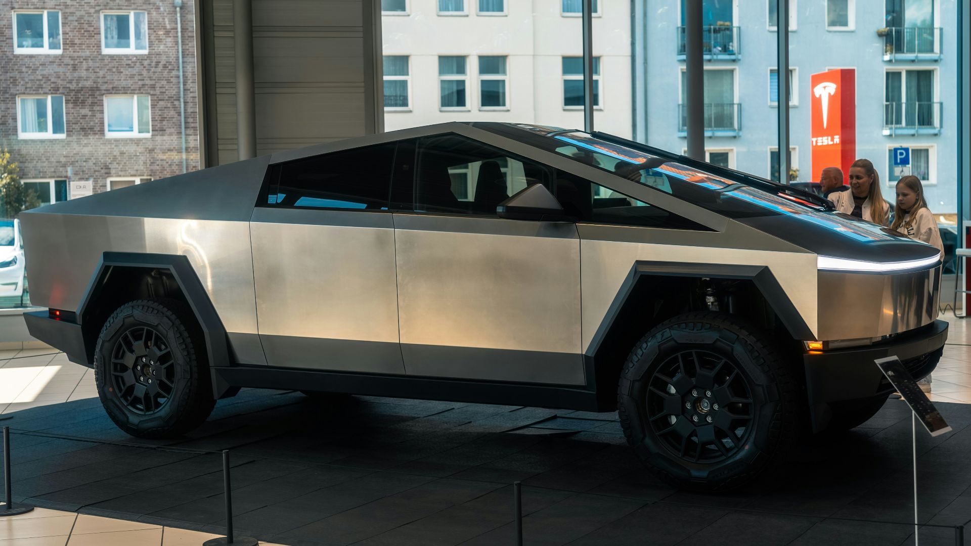 A futuristic car is on display in a building