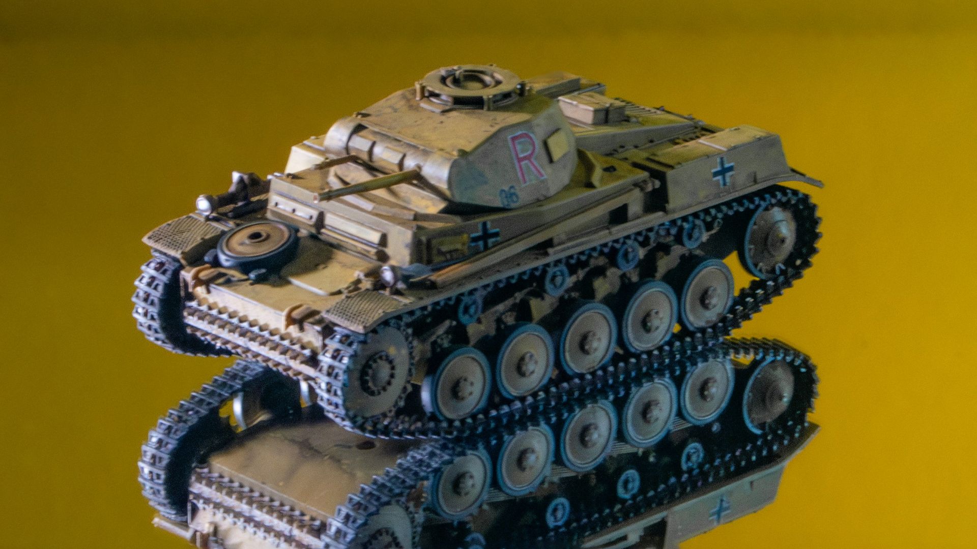 A toy tank sitting on top of a table