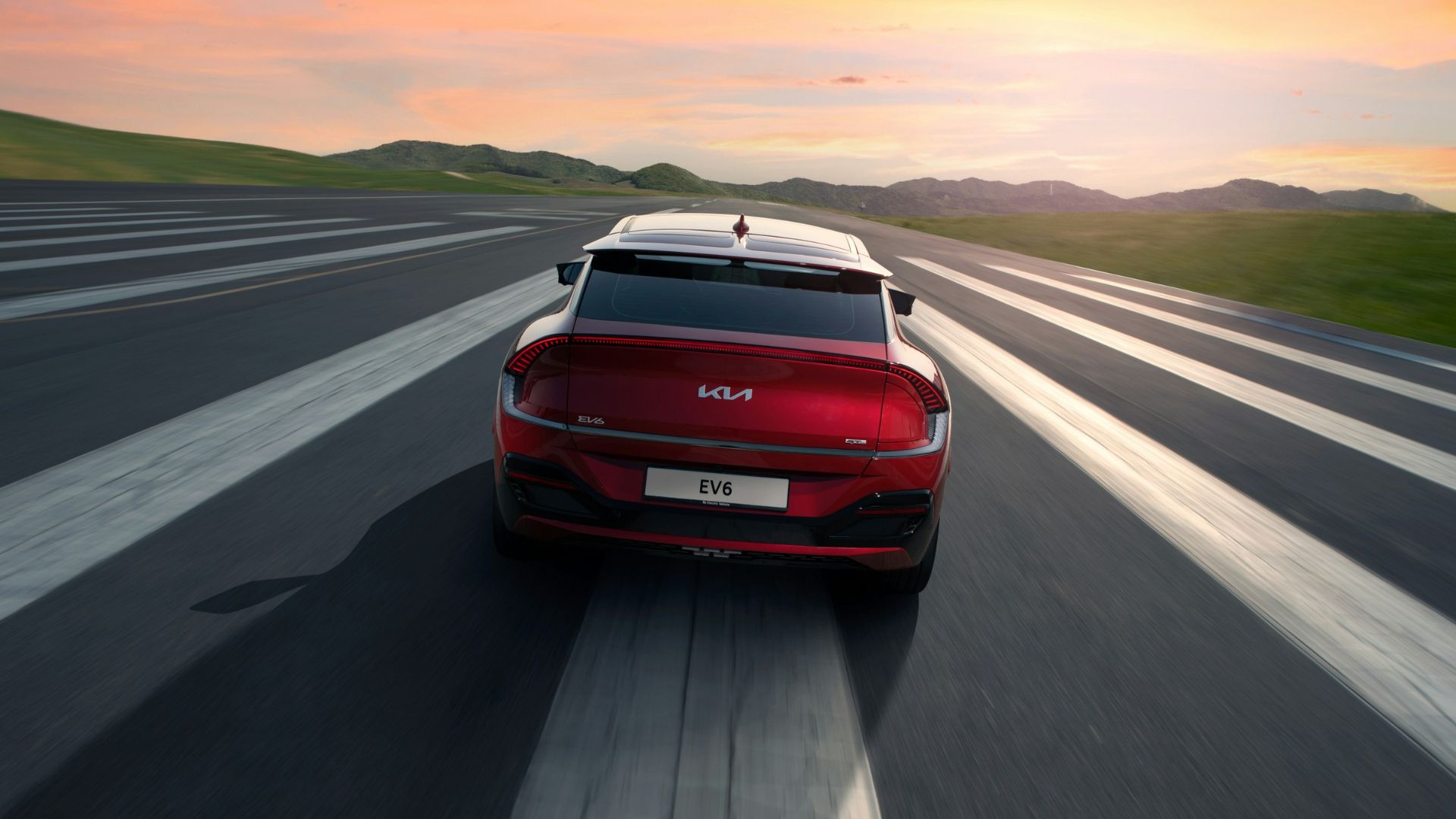 a red sports car on a road