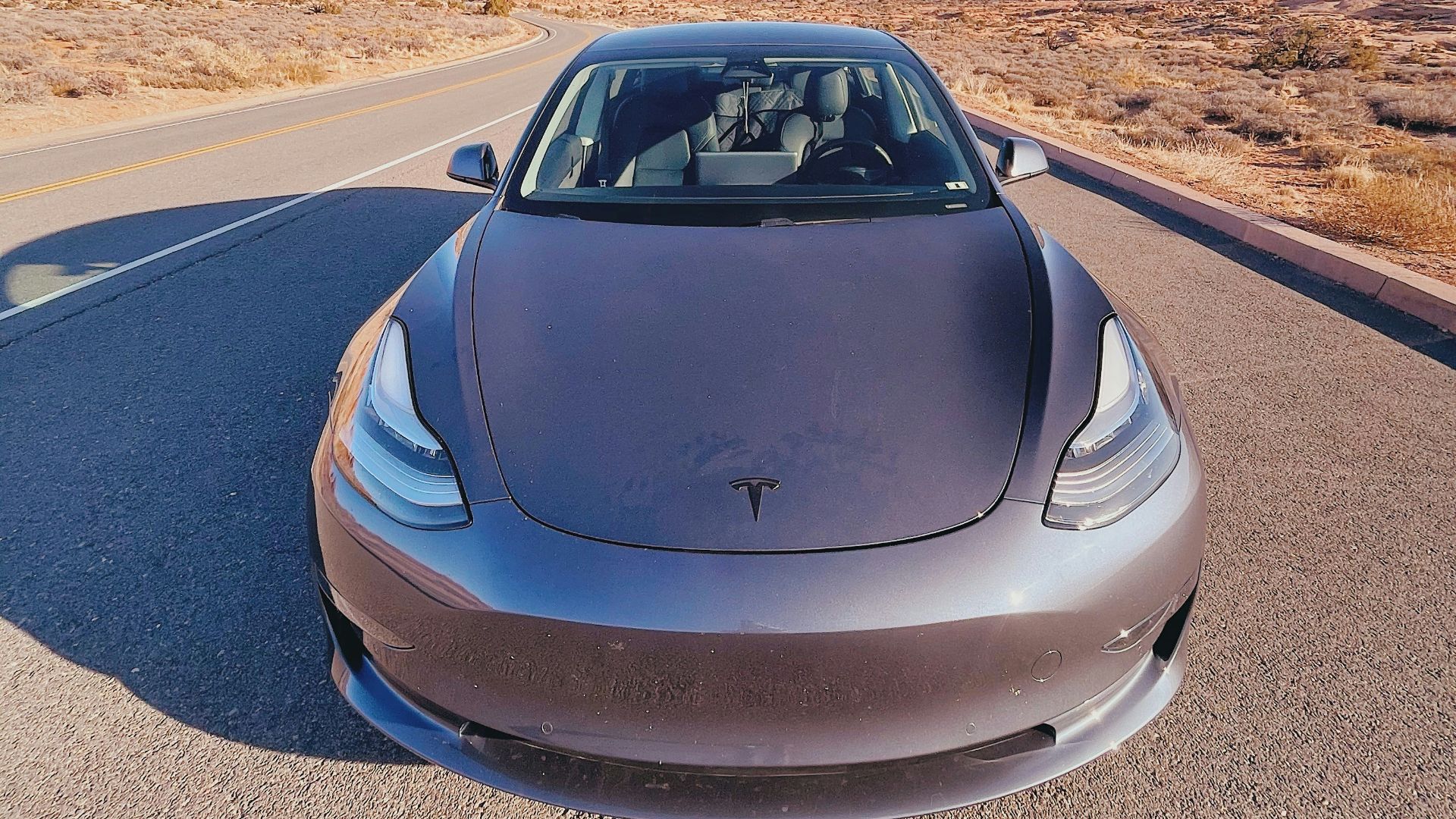 gray car on gray asphalt road during daytime