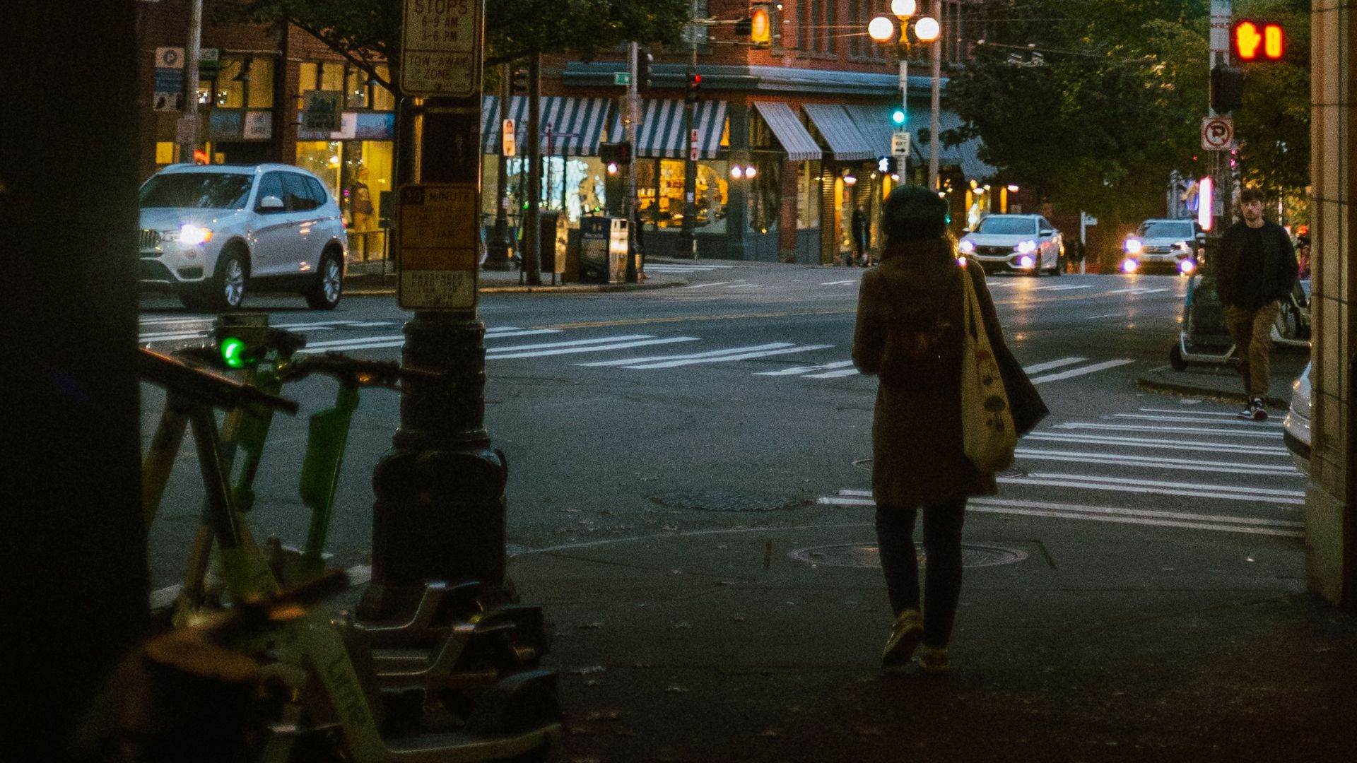 a person walking down a sidewalk