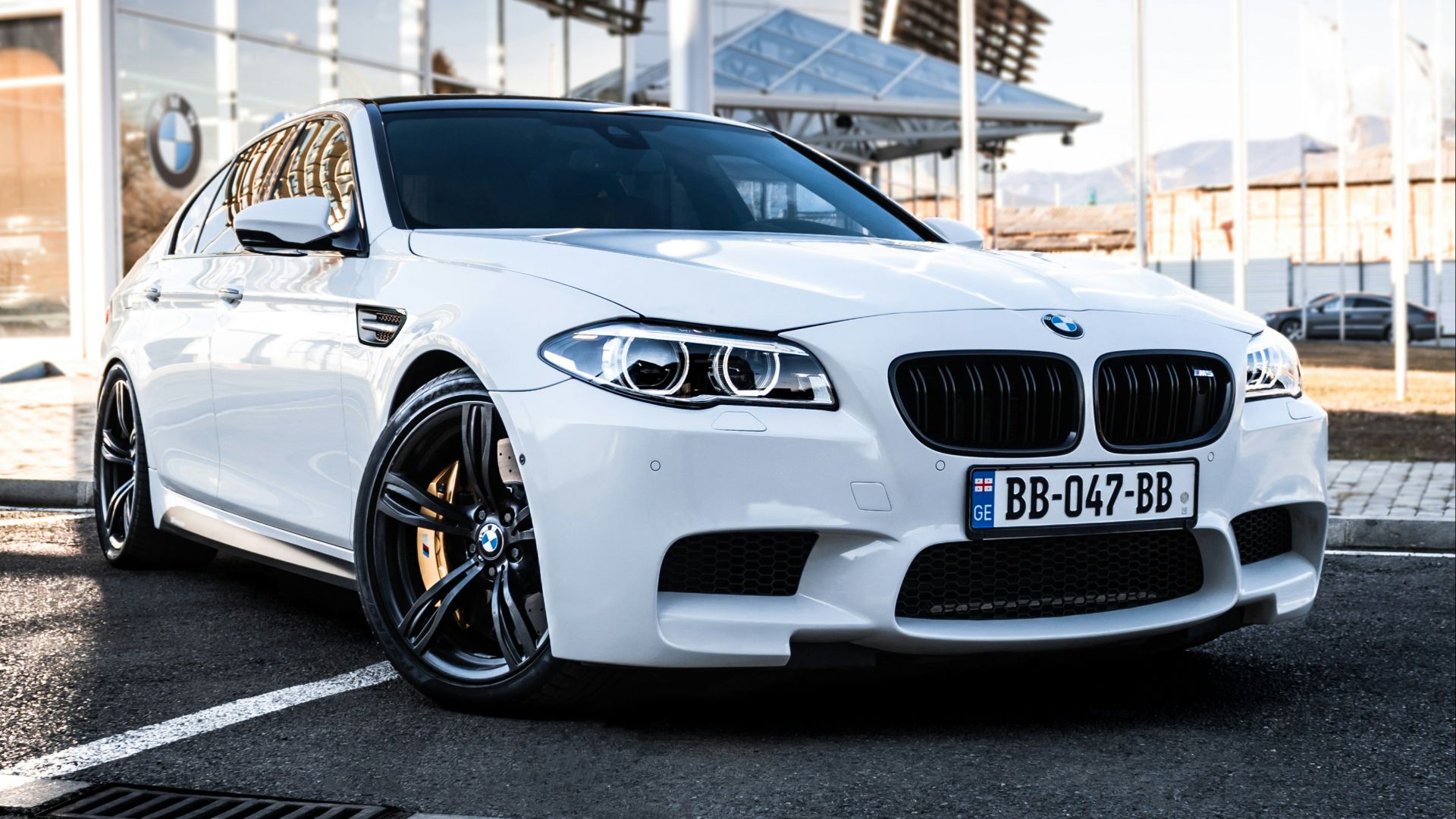 a white car parked in a parking lot