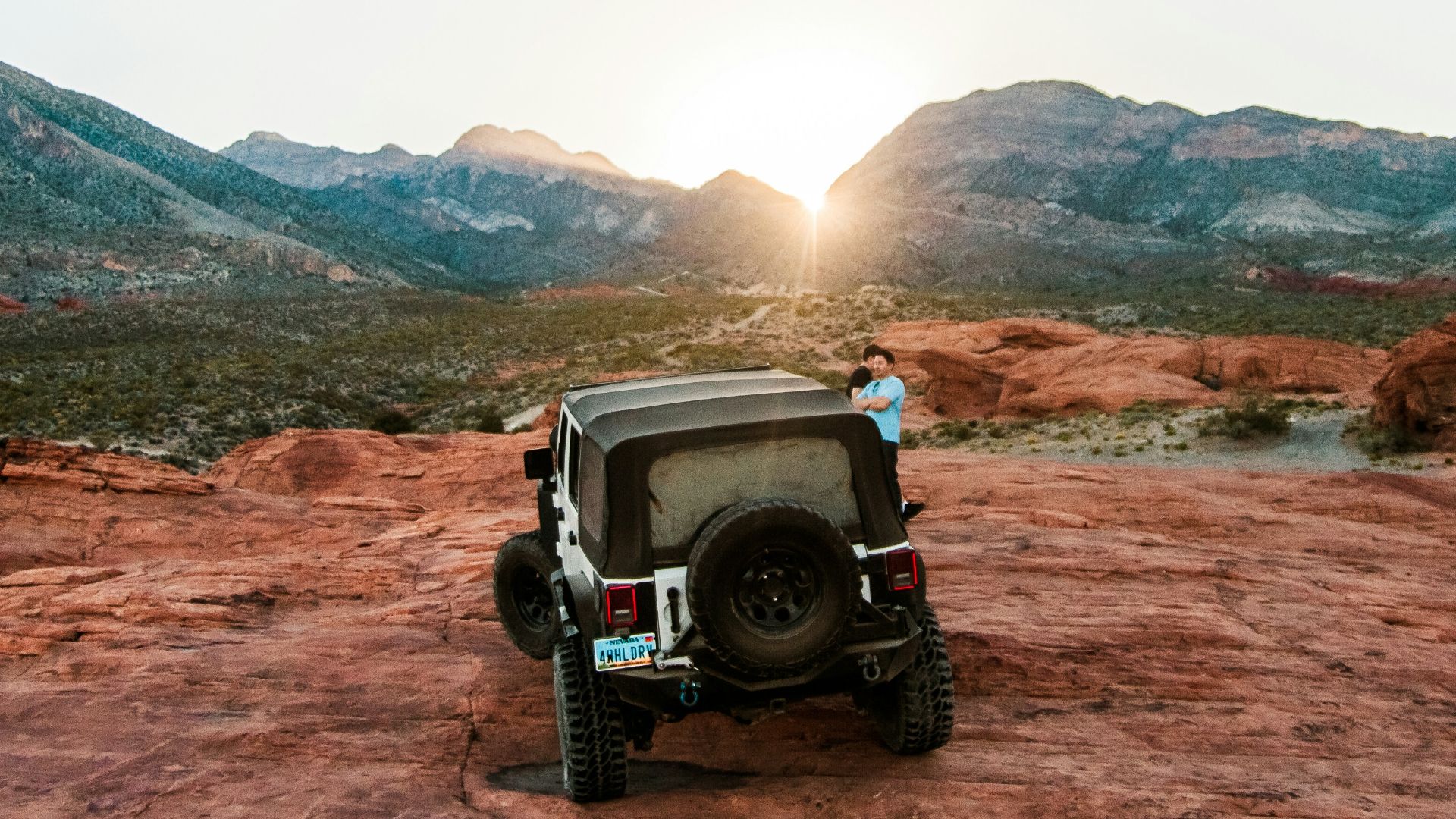 person standing near black off-road vehicle outdoors