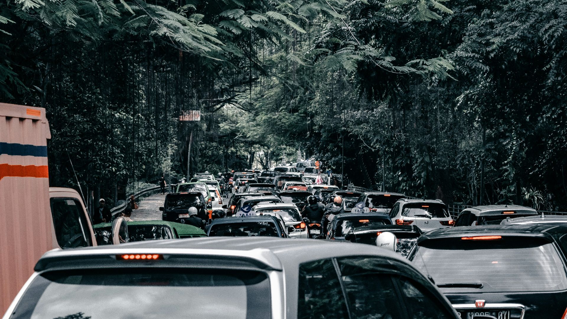 A bunch of cars that are sitting in the street