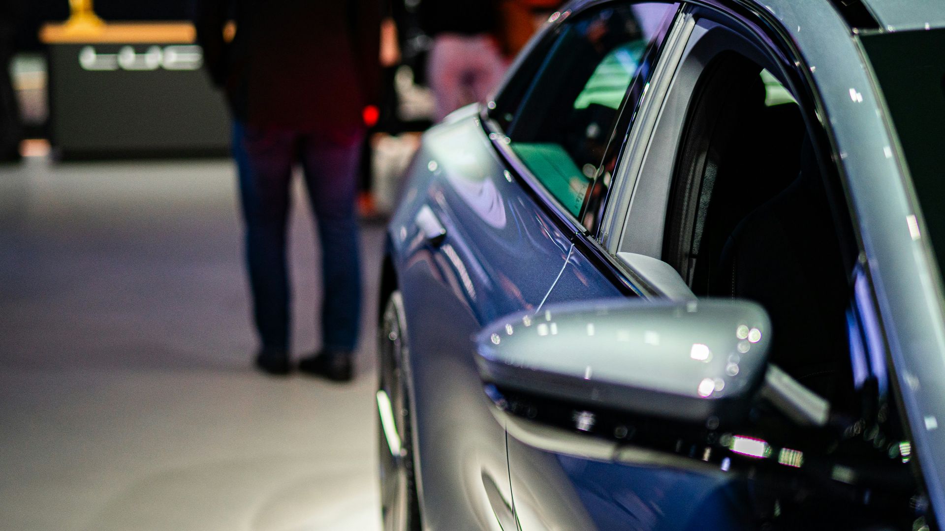 a close up of a car on display at a car show