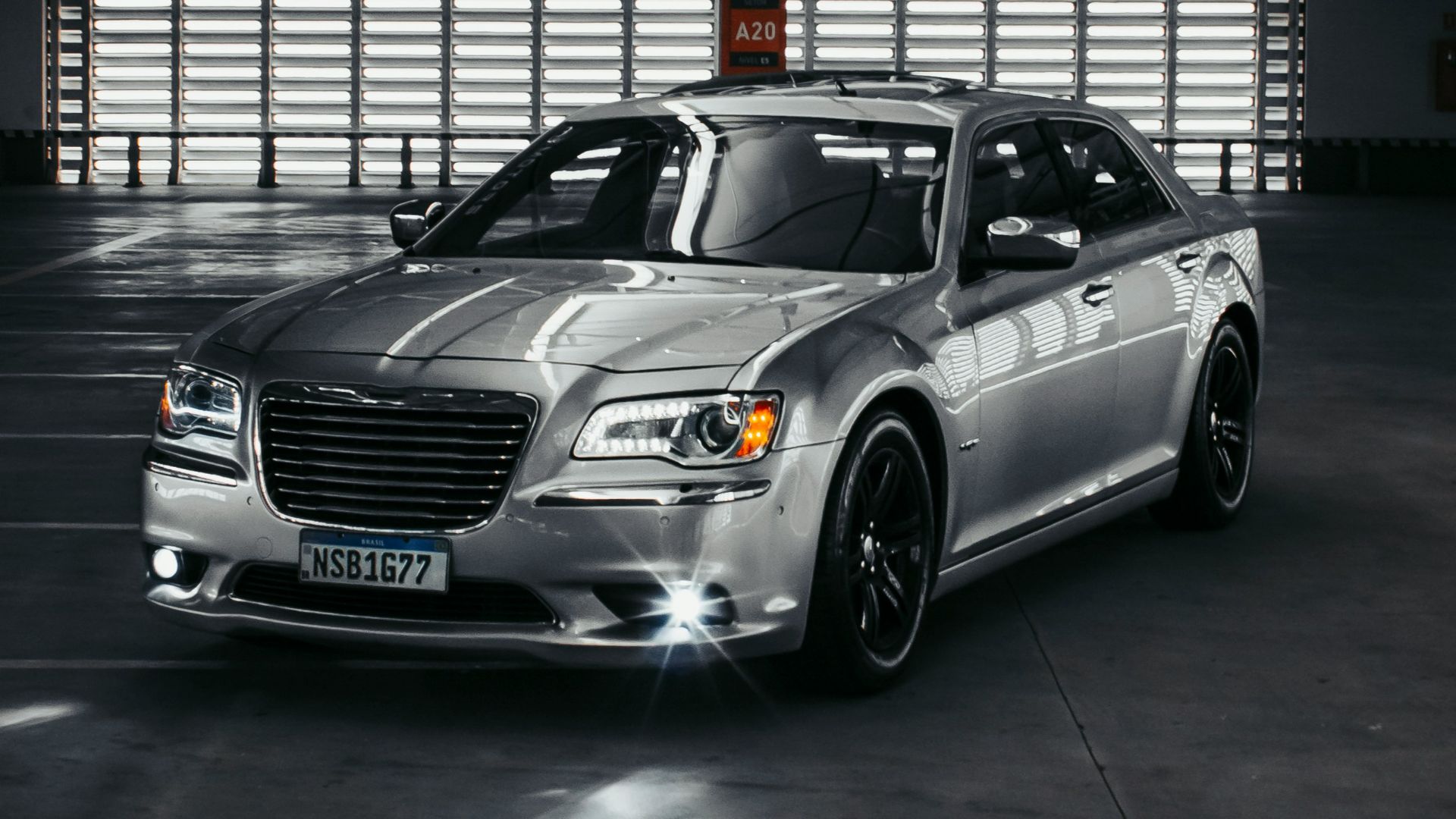 a silver car parked in a parking garage
