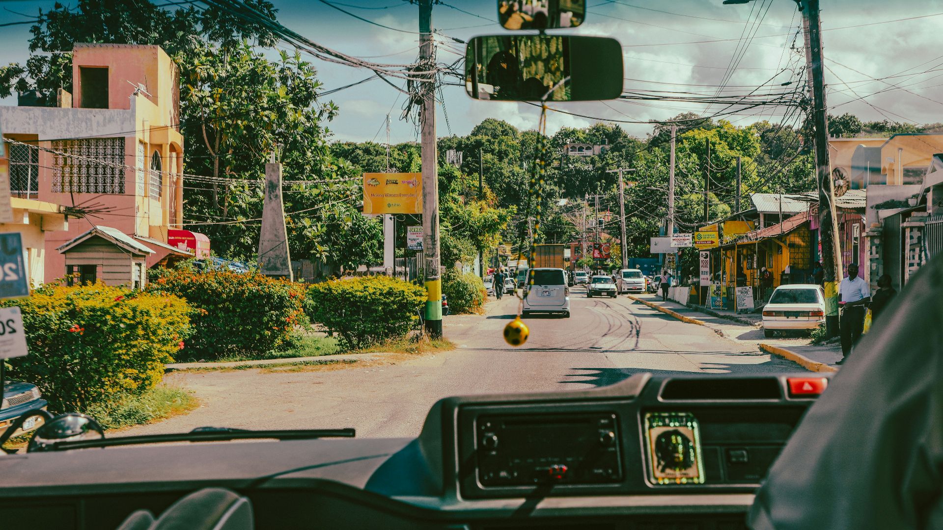 a view of a street from inside a vehicle