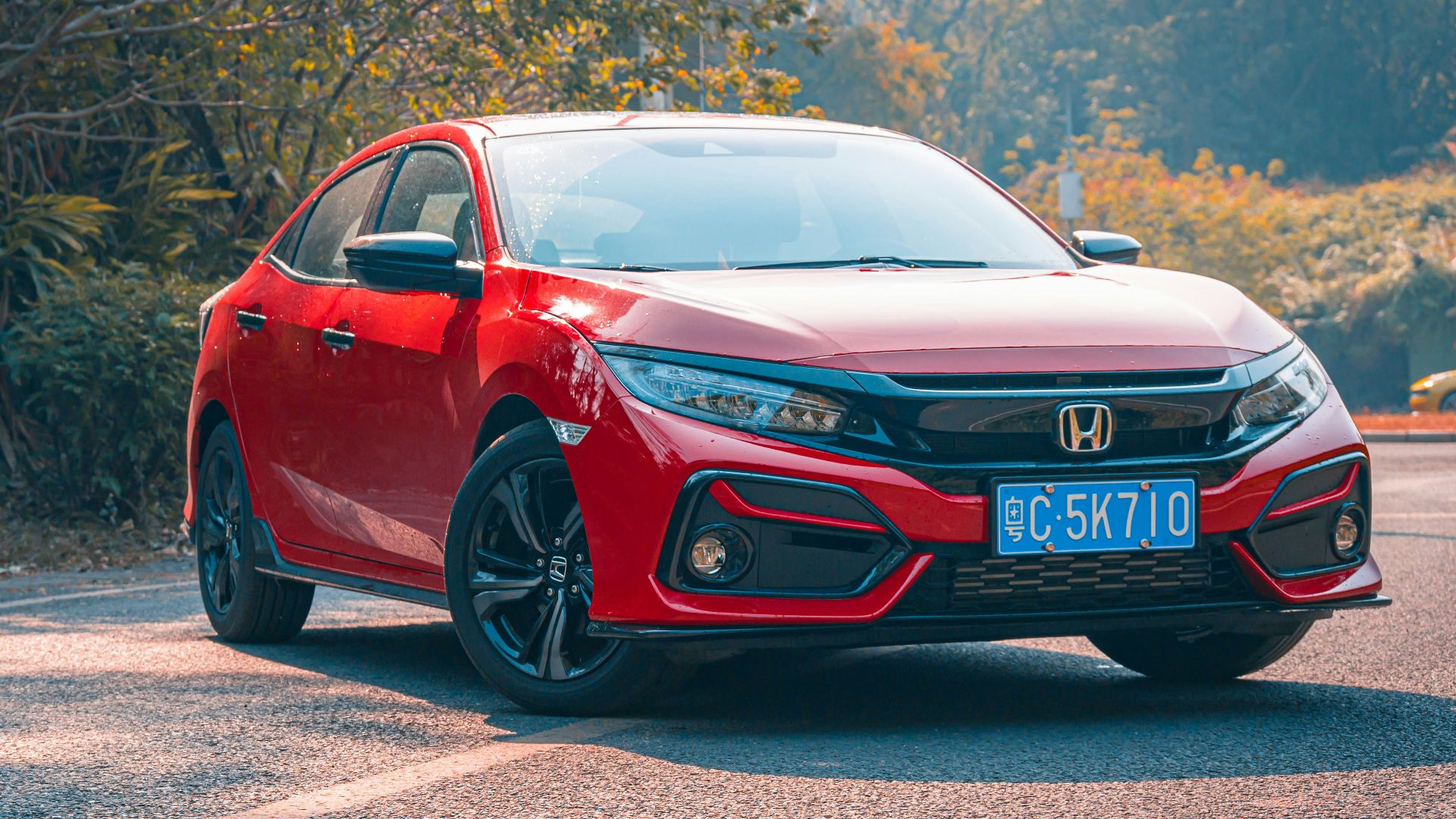 red audi r 8 on road during daytime