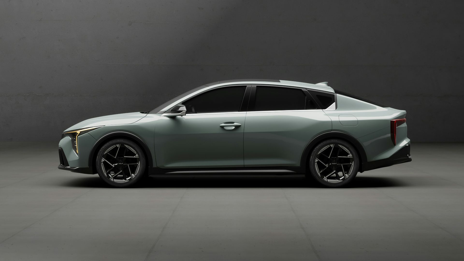 a silver sports car parked in a dark room