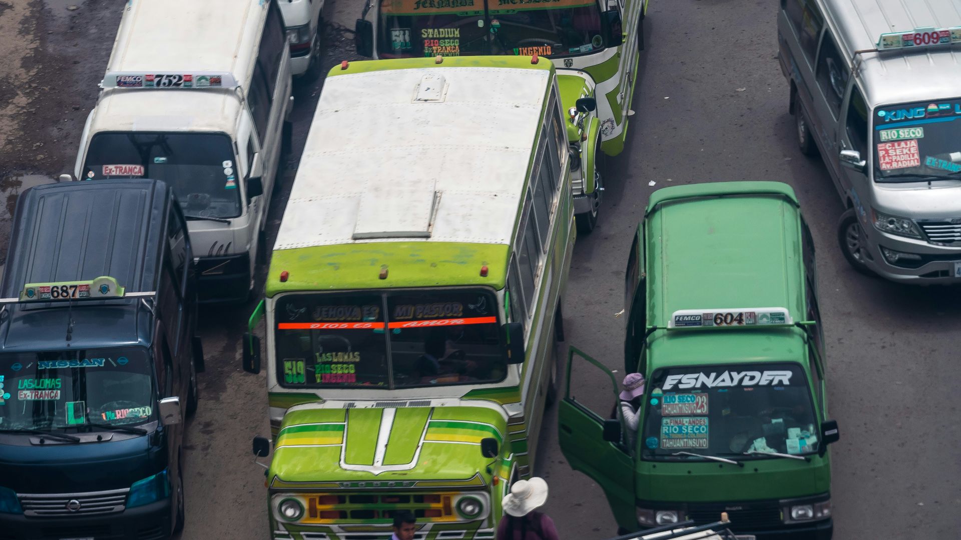 a bunch of buses that are sitting in the street