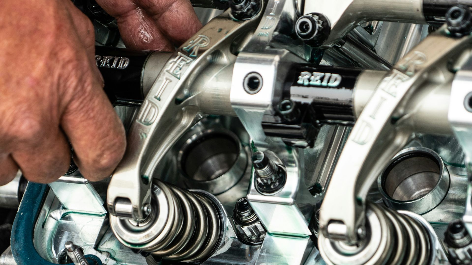 a close up of a person working on a machine