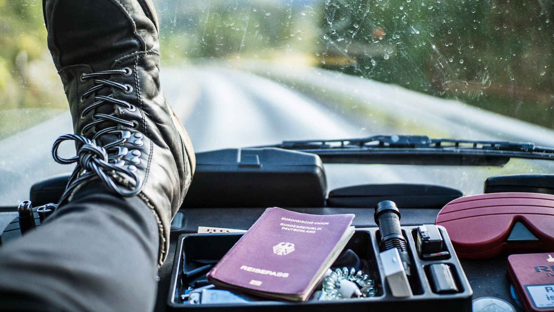 person in black leather boots