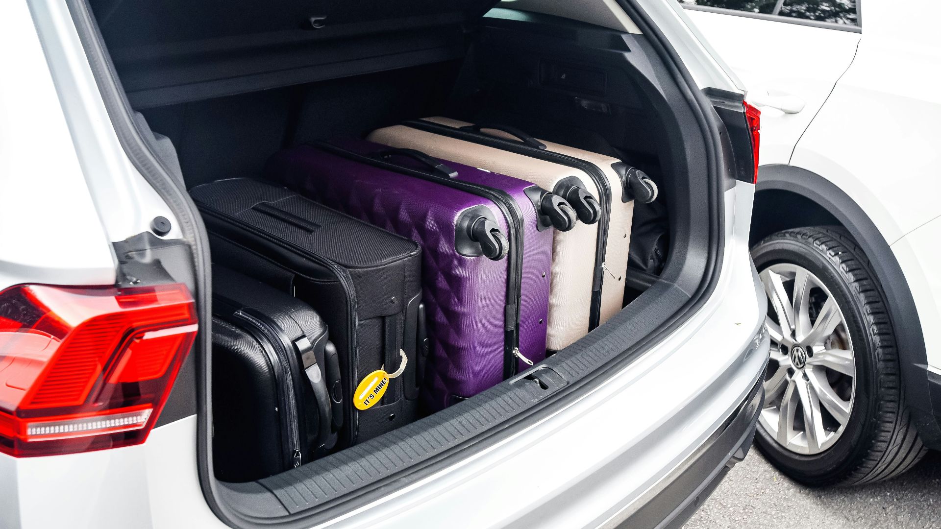 a car with a suitcase in the trunk