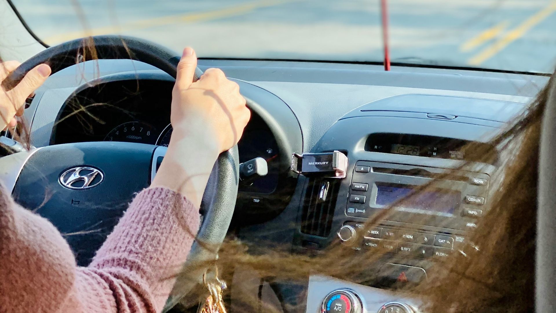 person driving car during daytime