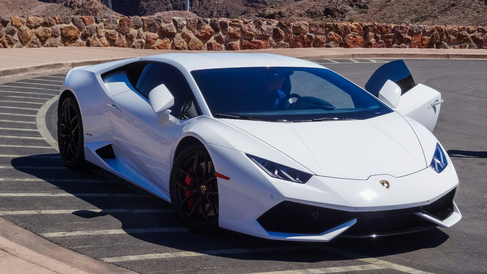 white sport car park at the street