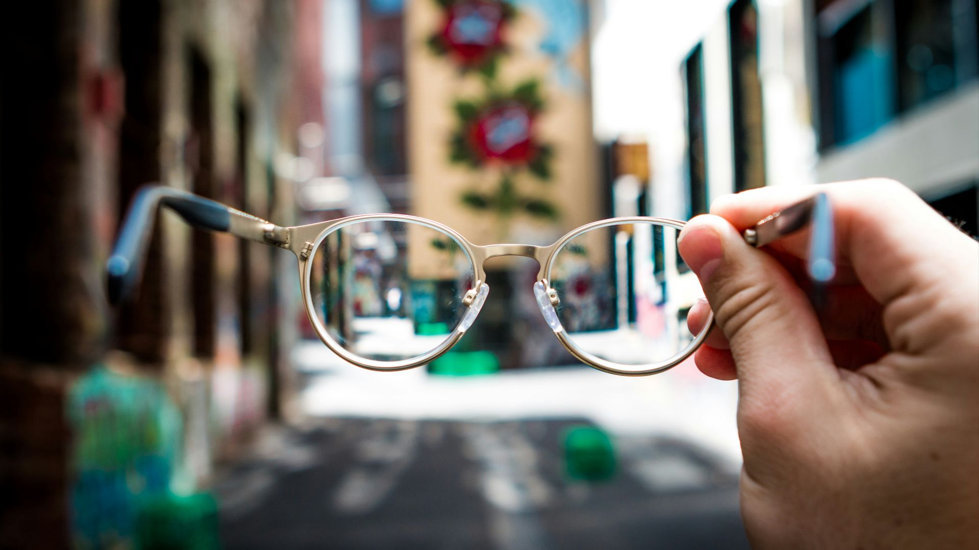 person holding eyeglasses