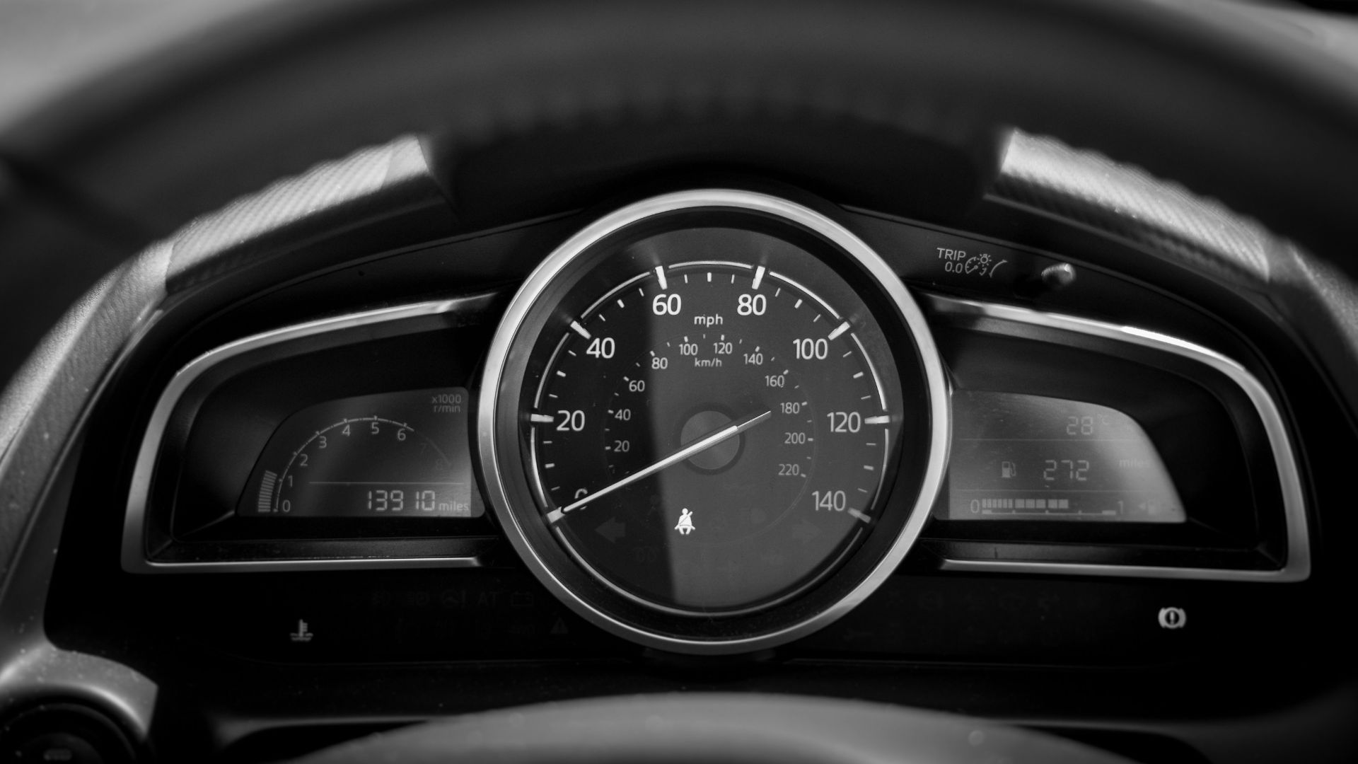 black and white car speedometer