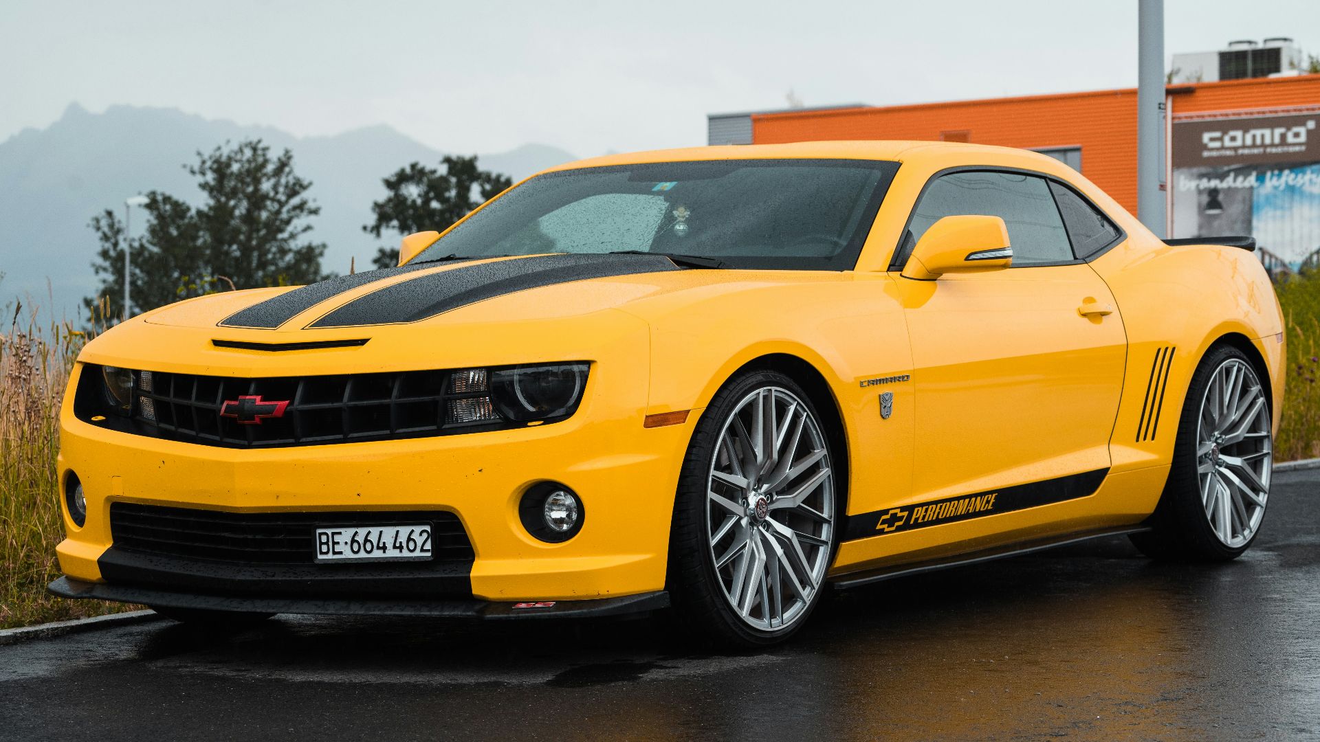 yellow Chevrolet coupe close-up photography