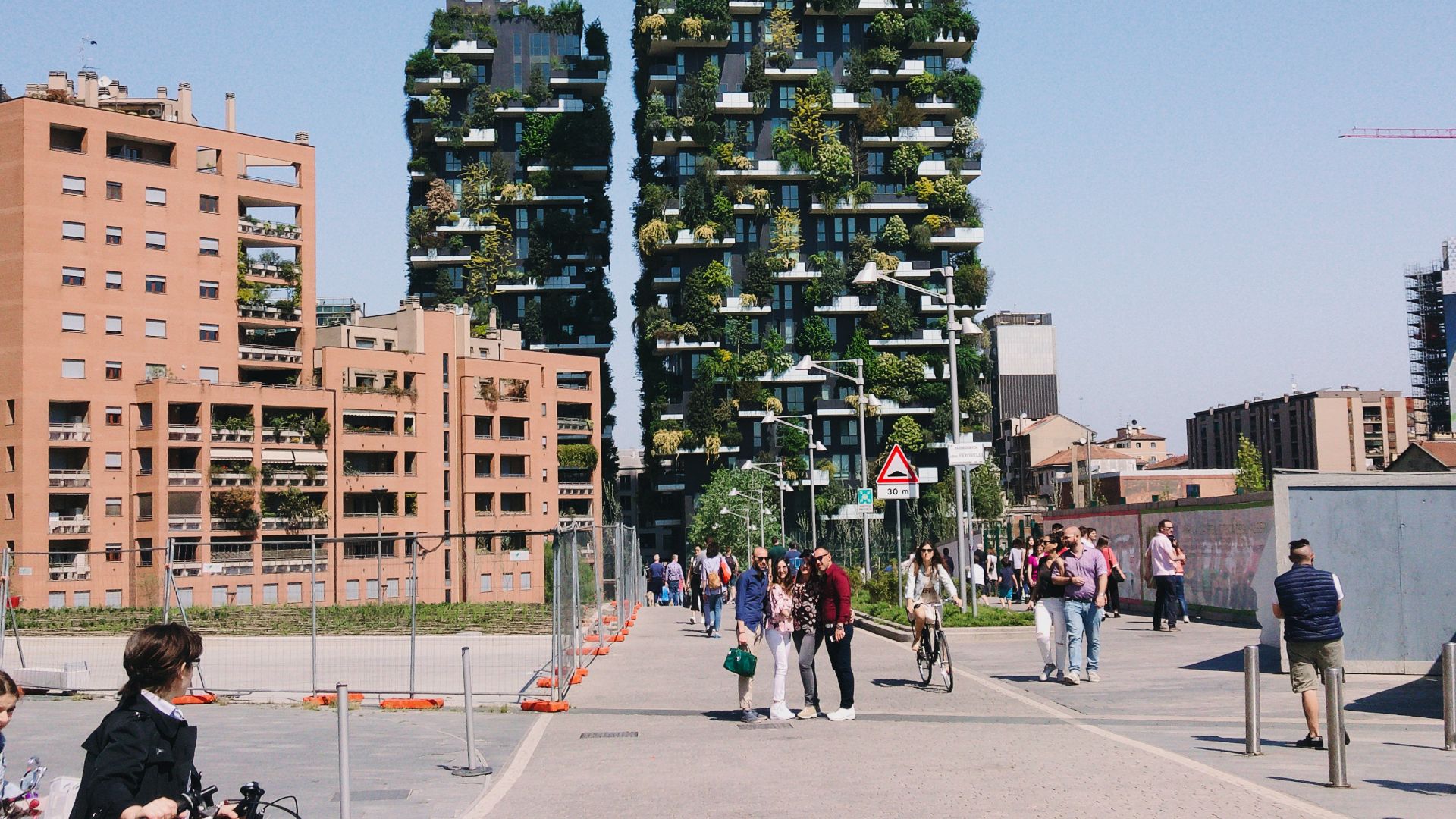 people walking on pathway near buildings