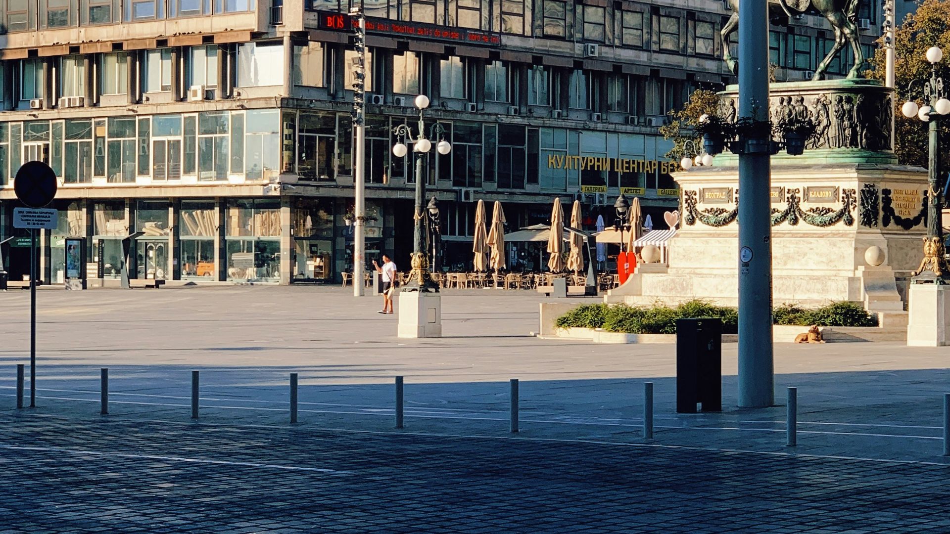 people walking on sidewalk near building during daytime