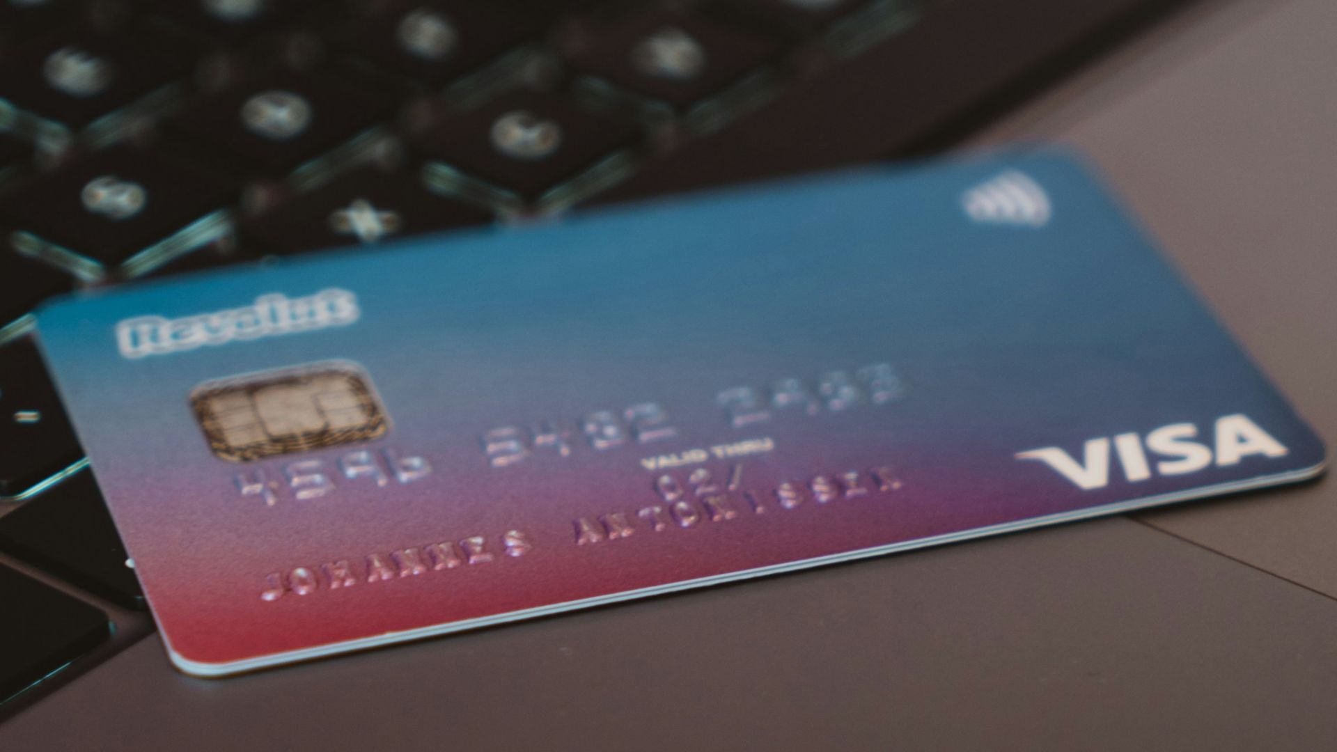 blue and white visa card on silver laptop computer