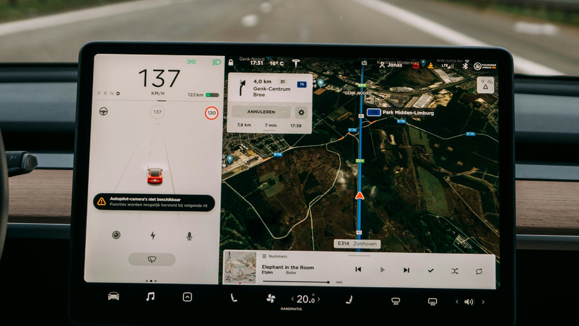 person holding white ipad inside car