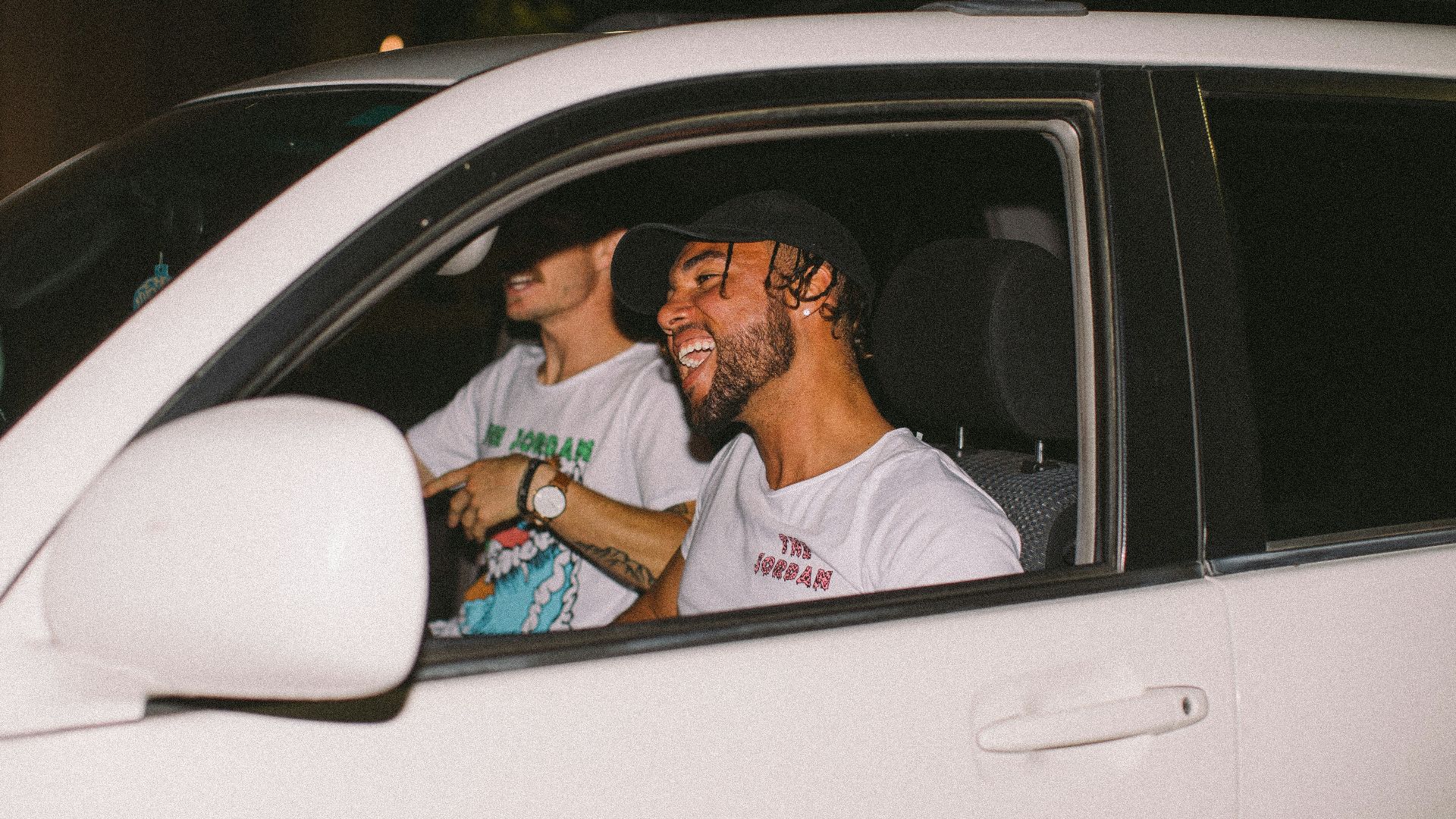 two men inside vehicle