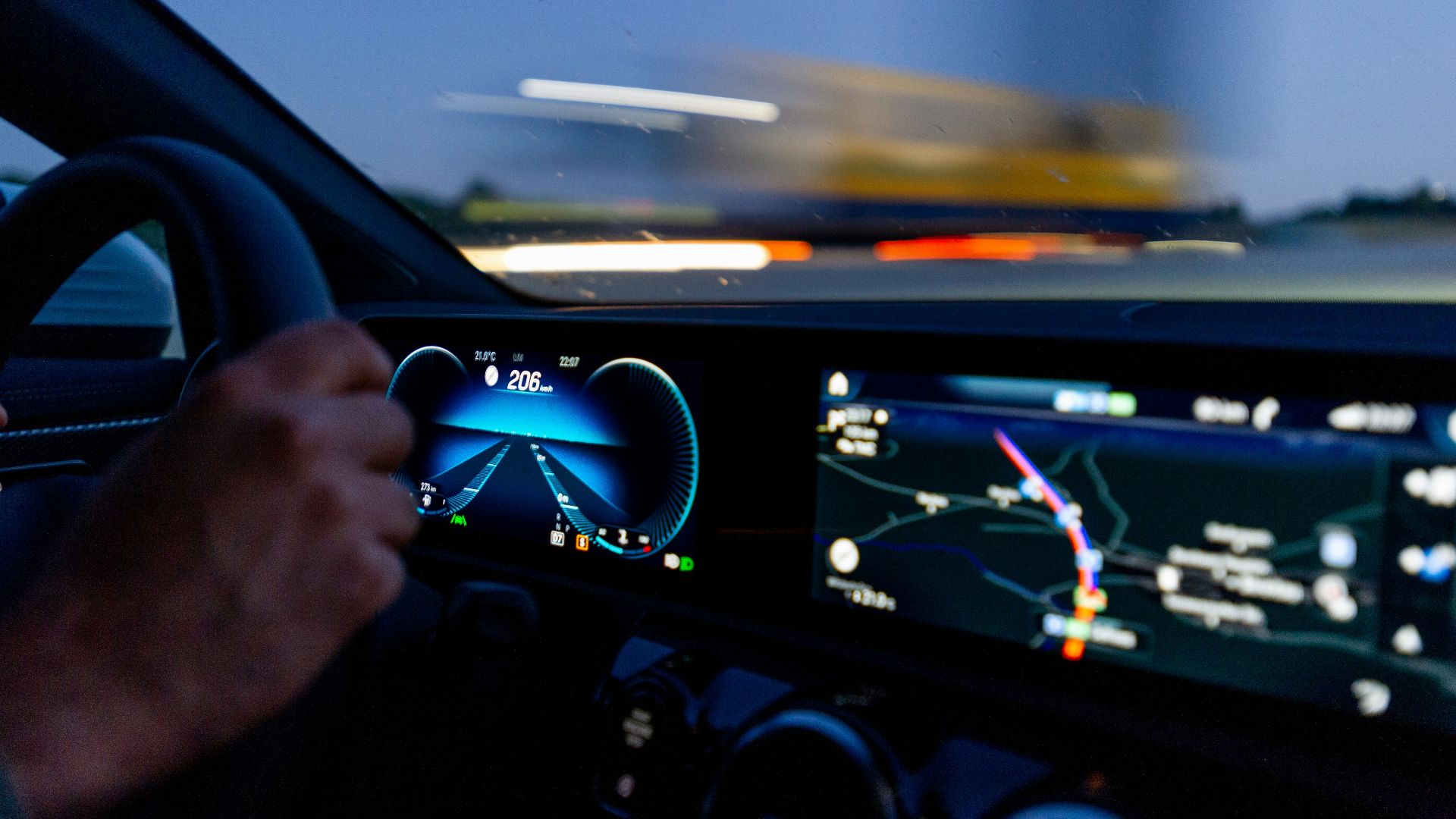 person's hand on steering wheel