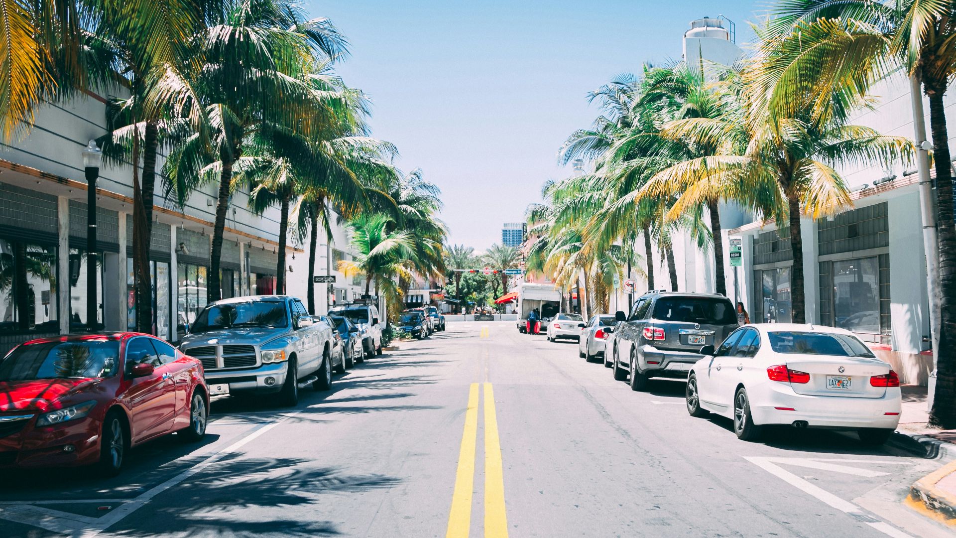 assorted cars parked side-by-side parking lot