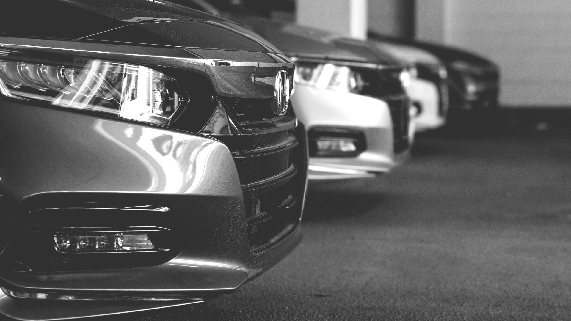 grayscale photo of car on road