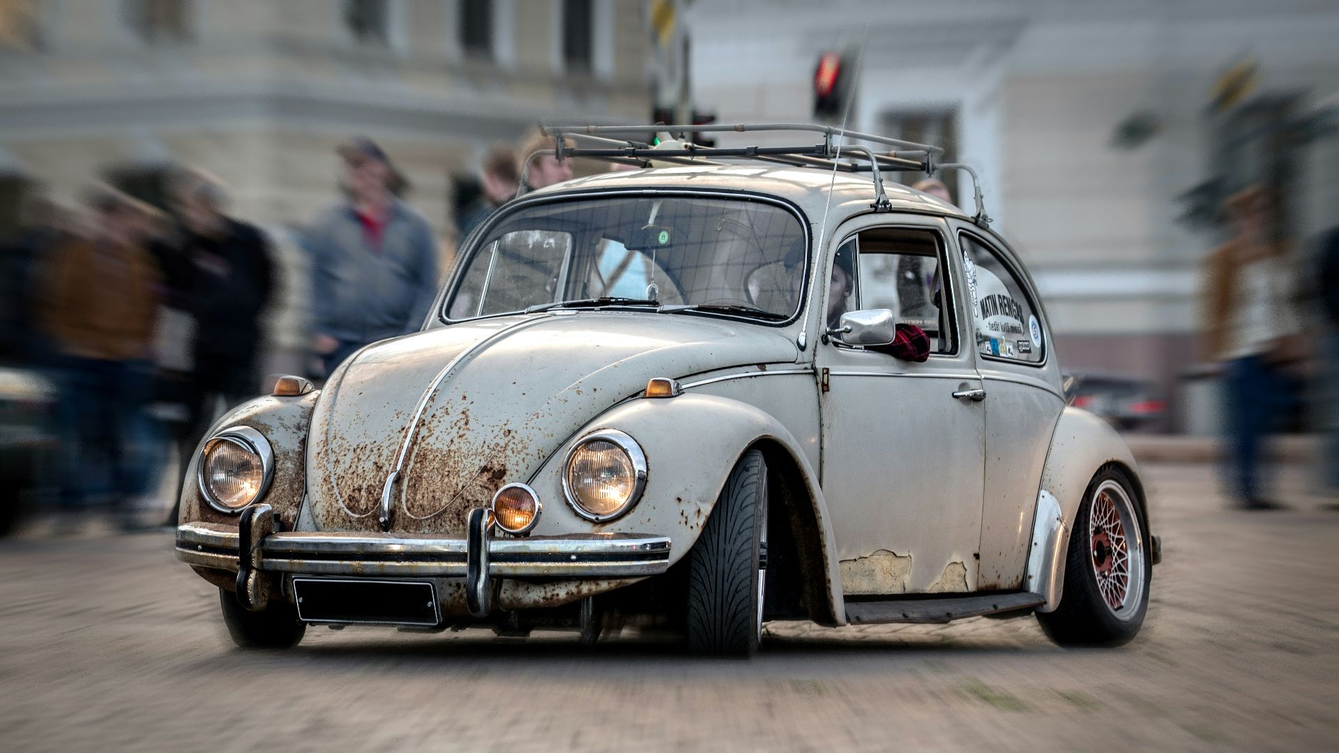 brown volkswagen beetle parked on street during daytime
