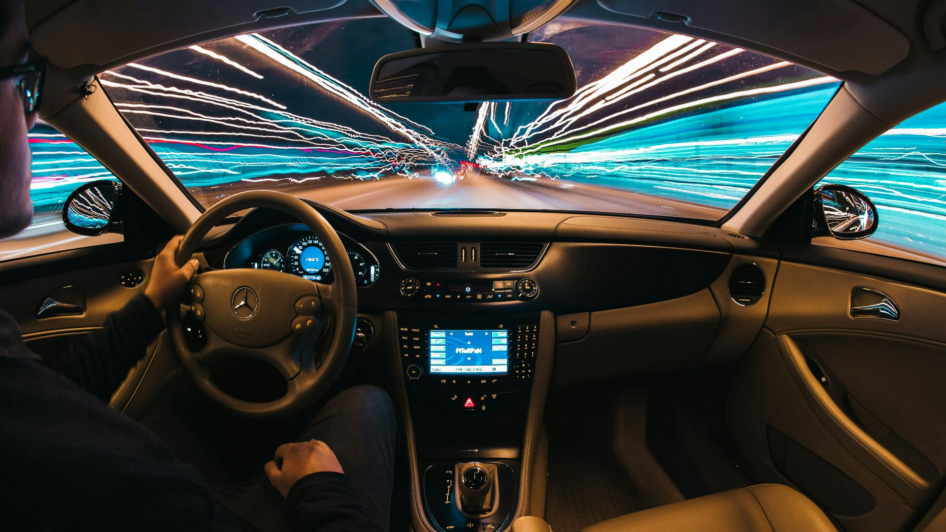 time lapse photography of man riding car